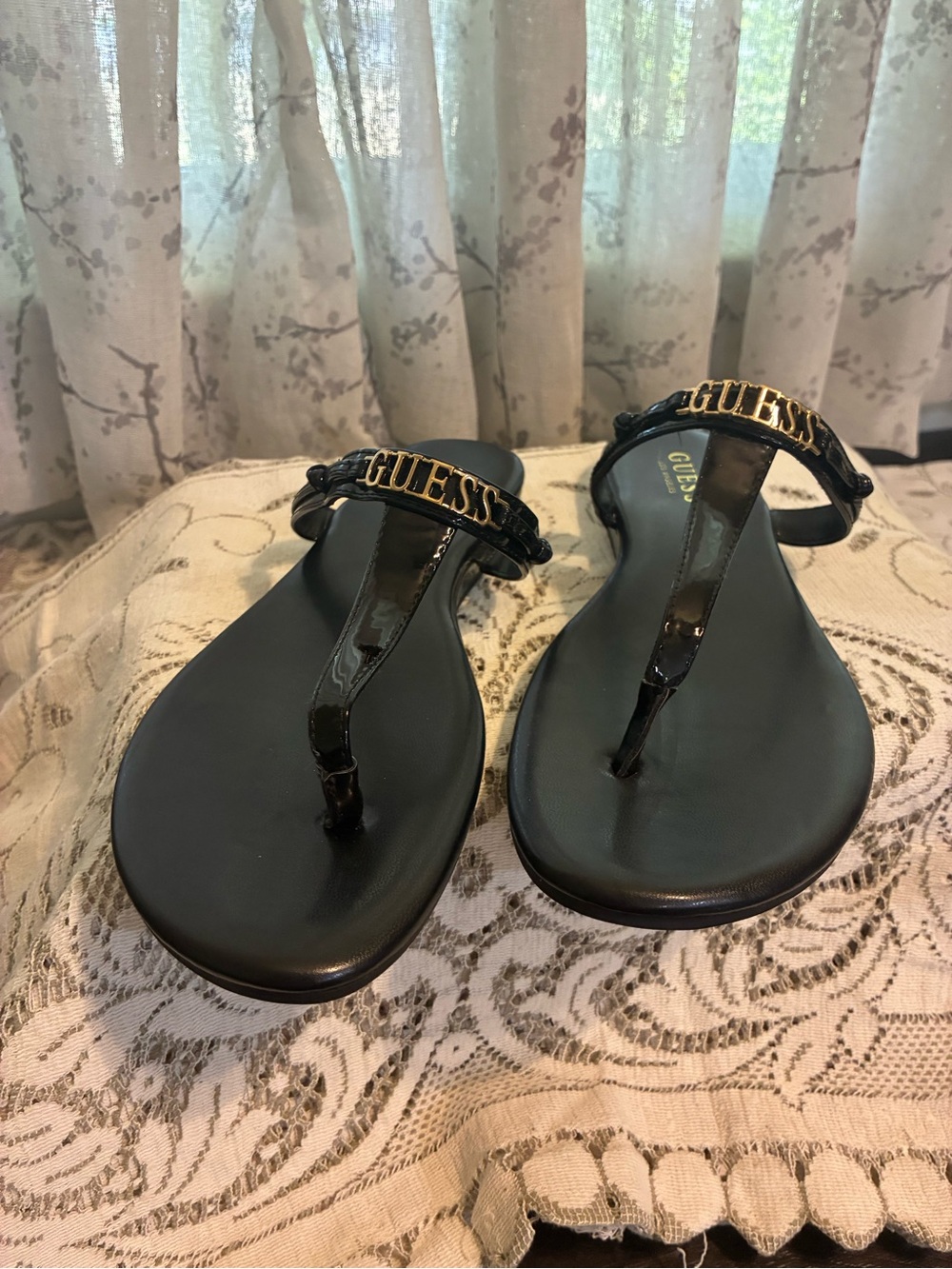 GUESS Black Patent Thong Sandals with Gold Logo Accent